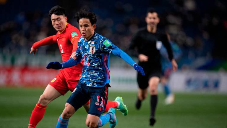 Japan’s Takefusa Kubo controls the ball during the FIFA World Cup Qatar 2022 Asian zone qualification football match between Japan and China at Saitama Stadium in Saitama on January 27, 2022. AFPPIX