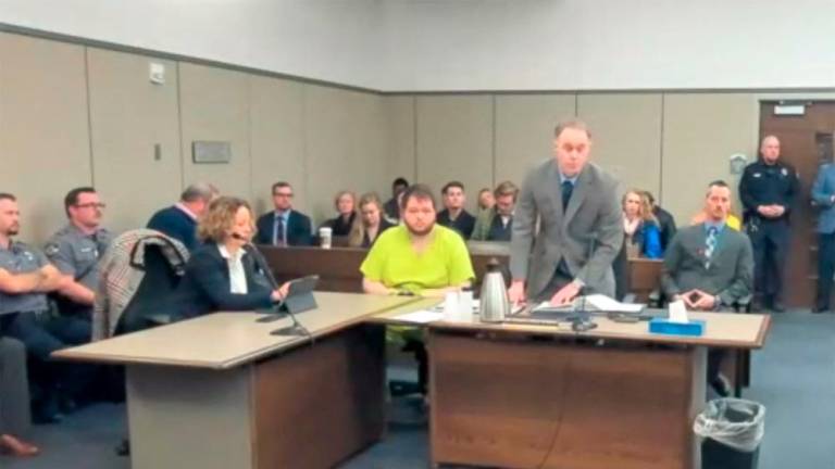 Anderson Lee Aldrich, 22, the suspect in the mass shooting that killed five people and wounded 17 at an LGBTQ nightclub appears seated before a judge during his charging hearing in Colorado Springs, Colorado, U.S. December 6, 2022 in a still image from livestream video. El Paso County Court/Handout via REUTERS