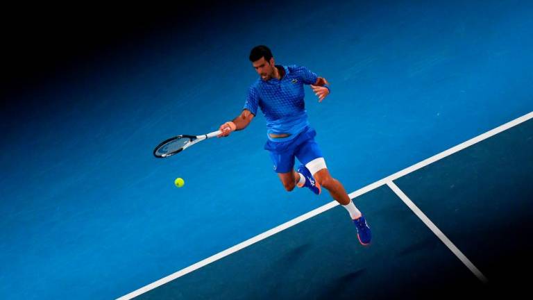 Serbia’s Novak Djokovic hits a return against Spain’s Roberto Carballes Baena during their men’s singles match on day two of the Australian Open tennis tournament in Melbourne on January 17, 2023. AFPPIX