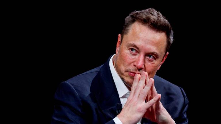FILE PHOTO: Elon Musk gestures as he attends the Viva Technology conference dedicated to innovation and startups at the Porte de Versailles exhibition centre in Paris, France, June 16, 2023. - REUTERSPIX
