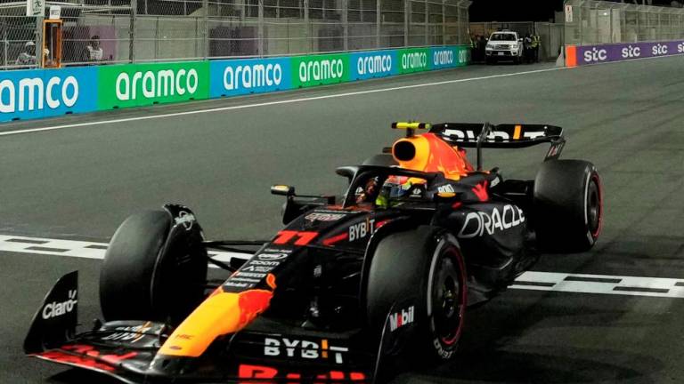 Red Bull Racing driver Sergio Perez crosses the finish line to win the Saudi Arabia Formula One Grand Prix at the Jeddah Corniche Circuit in Jeddah on March 19, 2023. AFPPIX