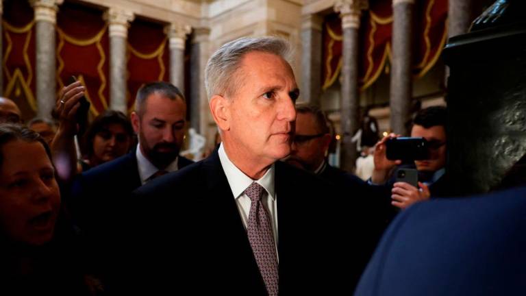 Speaker of the House Kevin McCarthy (R-CA) is pursued by journalists in Statuary Hall at the U.S. Capitol on October 02, 2023 in Washington, DC. Rep. Matt Gaetz (R-FL) said he would file a motion to vacate and attempt to oust McCarthy from the speakership following an agreement over the weekend to avert a partial shutdown of the federal government. AFPPIX