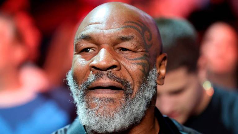 (FILES) In this file photo taken on May 06, 2022 former boxer Mike Tyson attends the junior welterweight bout between Montana Love and Gabriel Gollaz Valenzuela at T-Mobile Arena in Las Vegas, Nevada. AFPPIX
