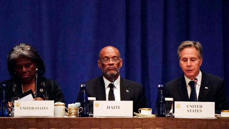 US Secretary of State Antony Blinken, with Haitian Prime Minister Ariel Henry (C) and US Ambassador to the United Nations Linda Thomas-Greenfield (L), addresses diplomats during a meeting on the security situation in Haiti, on the sidelines of the 78th UN General Assembly in New York City on September 22, 2023. AFPPIX