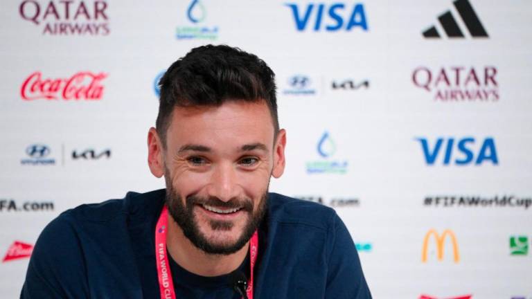 France's goalkeeper #01 Hugo Lloris attends a press conference at the Qatar National Convention Center (QNCC) in Doha on December 3, 2022, on the eve of the Qatar 2022 World Cup Round of 16 football match between France and Poland. - AFPPIX