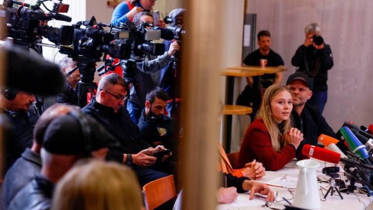 Aimee van Baalen (R), spokesperson of the “Letzte Generation” (Last Generation) group, addresses a news conference in Berlin on May 24, 2023 following morning raids by police on their activists. AFPPIX