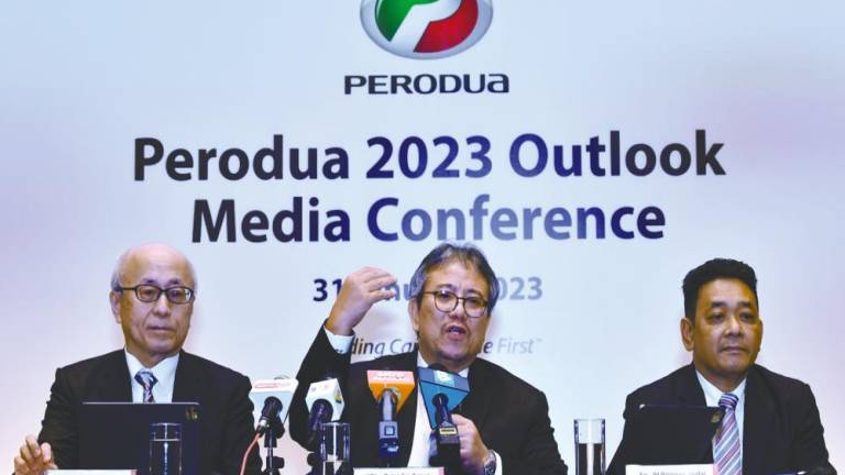 Perodua President and Chief Executive Officer (CEO) Datuk Seri Zainal Abidin Ahmad (centre) speaks at a press conference after presenting the Perodua 2023 Outlook Media Conference at a hotel on Jan 31 2023. - BERNAMAPIX