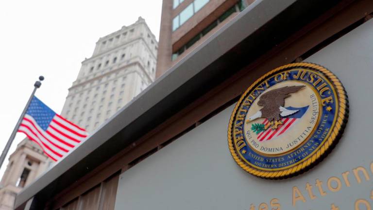 File photo: The seal of the United States Department of Justice is seen on the building exterior of the United States Attorney's Office of the Southern District of New York in Manhattan, New York City, U.S., August 17, 2020. REUTERSpix
