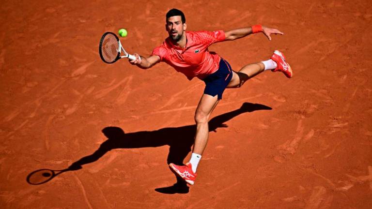 Novak Djokovic plays a forehand return to Alejandro Davidovich Fokina during their men’s singles match on day six of the Roland-Garros Open tennis tournament at the Court Philippe-Chatrier in Paris on June 2, 2023. AFPPIX