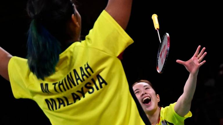 Malaysia’s Koon Le Pearly Tan (R) and Malaysia’s Muralitharan Thinaah celebrate winning against England’s Chloe Birch and Lauren Smith in their women’s doubles gold medal badminton match on day eleven of the Commonwealth Games at the NEC arena in Birmingham, central England, on August 8, 2022. AFPPIX