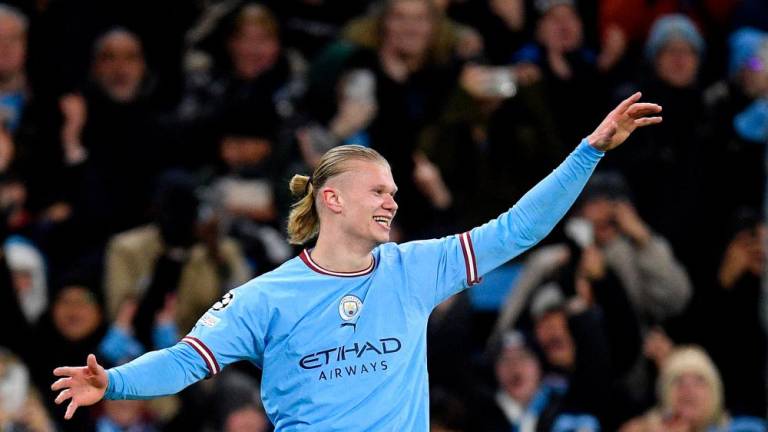 Manchester City’s Norwegian striker Erling Haaland celebrates scoring the team’s fifth goal, his fourth, during the UEFA Champions League round of 16 second-leg football match between Manchester City and RB Leipzig at the Etihad Stadium in Manchester, north west England, on March 14, 2023/AFPPix
