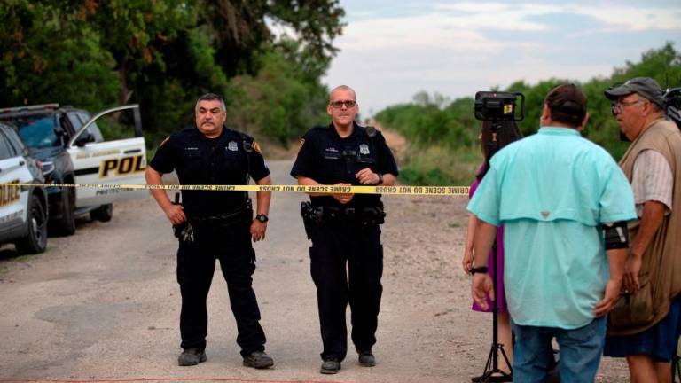 Law enforcement officers work at the scene where migrants were found dead inside a trailer truck in San Antonio, Texas, U.S. June 28, 2022. REUTERSPIX