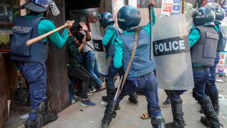Police charge baton on Bangladesh Nationalist Party (BNP) activities as they gathered in front of the party’s central office in Dhaka on December 7, 2022, ahead of a BNP rally called for December 10 in an effort to force Prime Minister Sheikh Hasina to resign. AFPPIX
