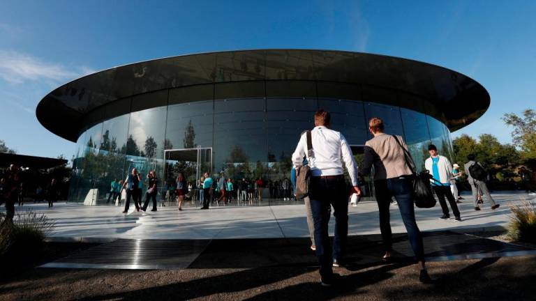 FILE PHOTO: Guests arrive for at the Steve Jobs Theater for an Apple event at their headquarters in Cupertino, California, U.S. September 10, 2019. - REUTERSPIX