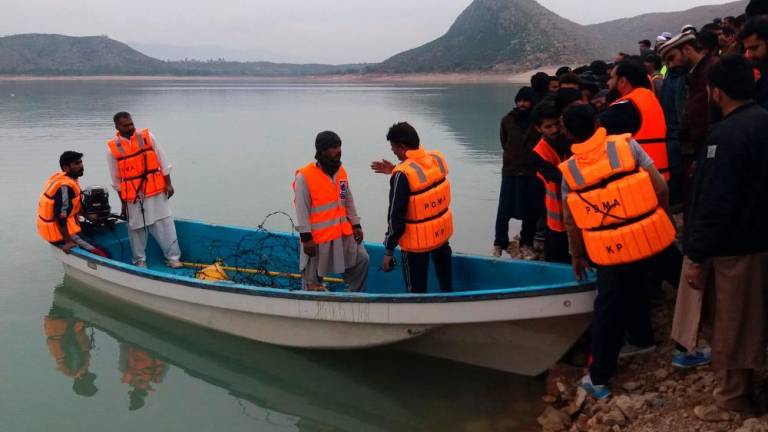 Rescue workers prepare to search for the victims drowned in the waters of Tanda Dam after a boat carrying students capsized in Kohat district of northern Khyber Pakhtunkhwa province on January 29, 2023. AFPPIX