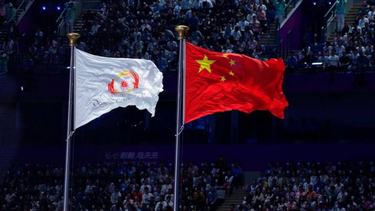 The flag of China and the Olympic Council of Asia flew at the official opening ceremony of the Hangzhou 2022 Asian Games at the Hangzhou Olympic Games Central Stadium on Sept 23 2023. - fotoBERNAMA