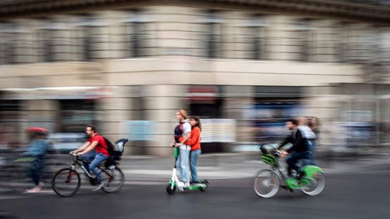 In this file photo taken on September 13, 2019, youths ride on a free floating rental electric scooter in Paris, during a one-day strike of Paris public transports operator RATP employees over French government’s plan to overhaul the country’s retirement system. AFPPIX