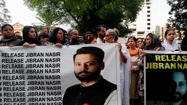 People carry banners demanding the release of human rights activist and lawyer Jibran Nasir, who according to them was abducted, during a protest in Karachi, Pakistan June 2, 2023. REUTERSpix