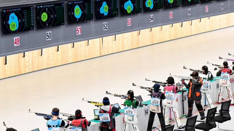 Athletes compete in the women's 10m air rifle shooting qualification during the 2022 Asian Games in Hangzhou in China’s eastern Zhejiang province on September 24, 2023. - AFPPIX
