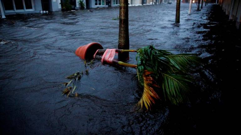 A flooded street is seen in downtown as Hurricane Ian makes landfall in southwestern Florida, in Fort Myers, Florida, U.S. September 28, 2022. - REUTERSPIX