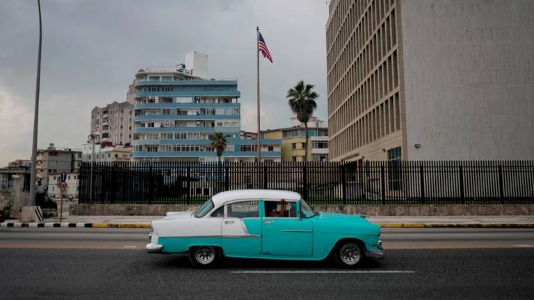 File photo: A vintage car passes by the US Embassy in Havana, Cuba, October 30, 2020. REUTERSpix
