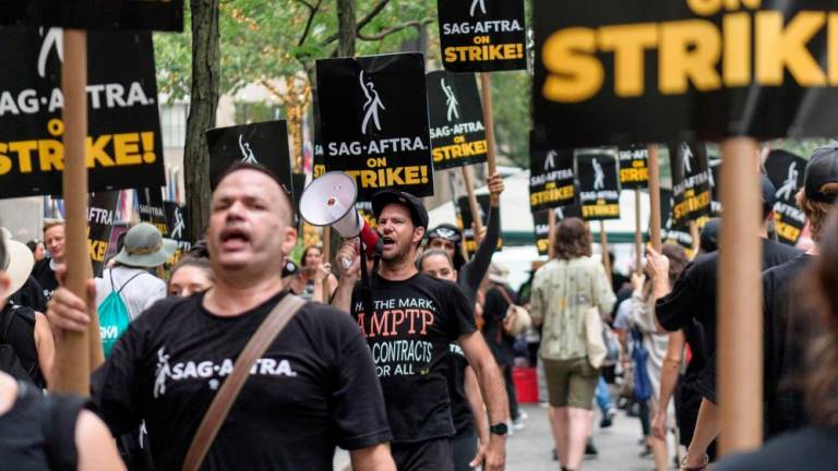 (FILES) SAG-AFTRA members and supporters walk the picket line as members of the Screen Actors Guild strike in New York on July 19, 2023. - AFPPIX