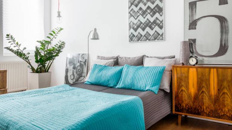 Add a pop of colour to a neutral room with some bedding in a bright shade.