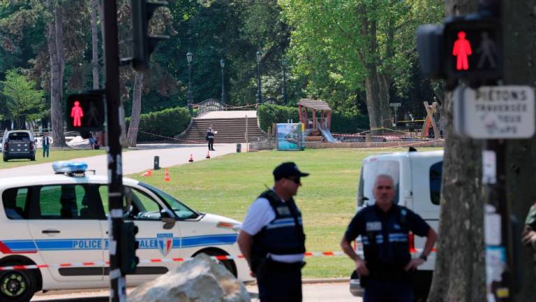 French police secure the area after several children and an adult have been injured in a knife attack in Annecy, in the French Alps, France, June 8, 2023. REUTERSpix