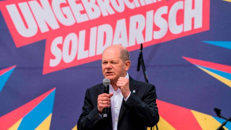 German Chancellor Olaf Scholz speaks on stage as he attends the country’s central labour day rally organised by the German Trade Union Confederation (DGB) on Mayday, May 1, 2023 in Koblenz, western Germany. AFPPIX