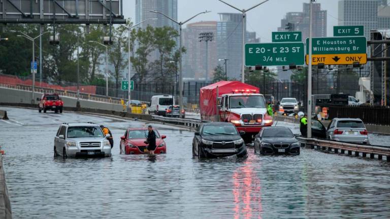 Cars in floodwater on the FDR highway in Manhattan, New York on September 29, 2023. AFPPIX