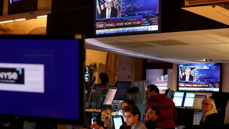 Powell appears on a screen on the trading floor of the New York Stock Exchange during a news conference following a Fed rate announcement on Wednesday. – Reuterspic