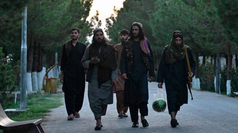 In this photograph taken on August 10, 2022, members of the Taliban arrive at Wazir Akbar Khan Hill in Kabul. AFPPIX