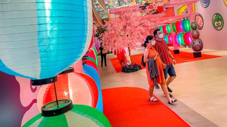 Foreign tourists taking pictures in Japanese decorations at Lalaport shopping centers in Kuala Lumpur. adib rawi yahya/theSun