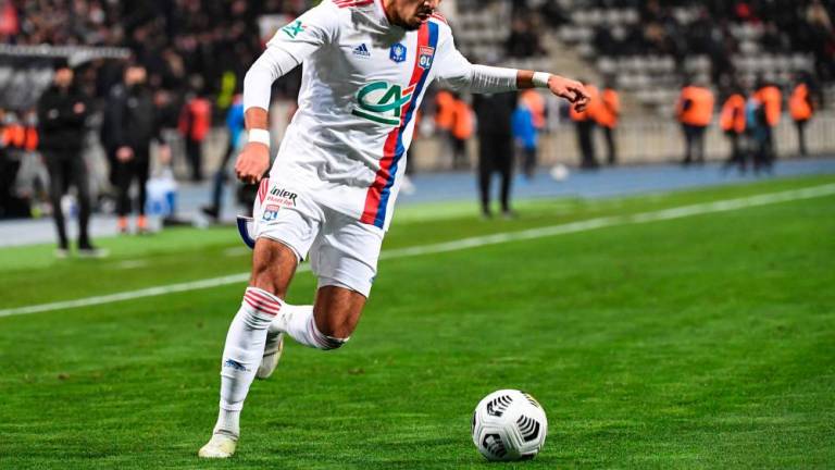 In this file photo taken on December 17, 2021 Lyon’s French defender Malo Gusto plays the ball during the French Cup round of 64 football match between Paris FC and Olympique Lyonnais (OL) at the Charlety stadium in Paris. AFPPIX