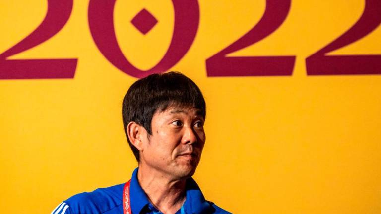 Japan’s coach Hajime Moriyasu poses on the green carpet ahead of a press conference at the Qatar National Convention Center (QNCC) in Doha on November 30, 2022, on the eve of the Qatar 2022 World Cup football match between Japan and Spain/AFPPix