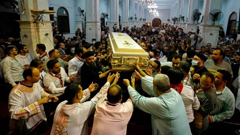 Egyptian mourners attend the funeral of victims killed in Cairo Coptic church fire, at the church of the Blessed Virgin Mary in the Giza Governorate on August 14, 2022. AFPPIX
