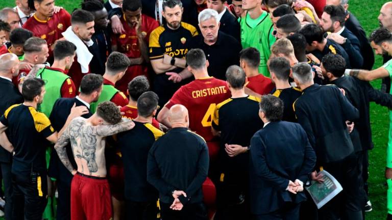 Jose Mourinho (C) speaks to his players after their loss in the UEFA Europa League final football match between Sevilla FC and AS Roma at the Puskas Arena in Budapest on May 31, 2023. AFPPIX