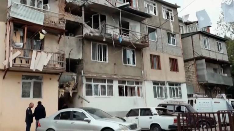A video grab made on September 20, 2023 from footage released by the Nagorno-Karabakh Foreign Ministry shows damaged apartment buildings in Stepanakert, on the first day of Azerbaijan's renewed offensive on the region. AFPPIX