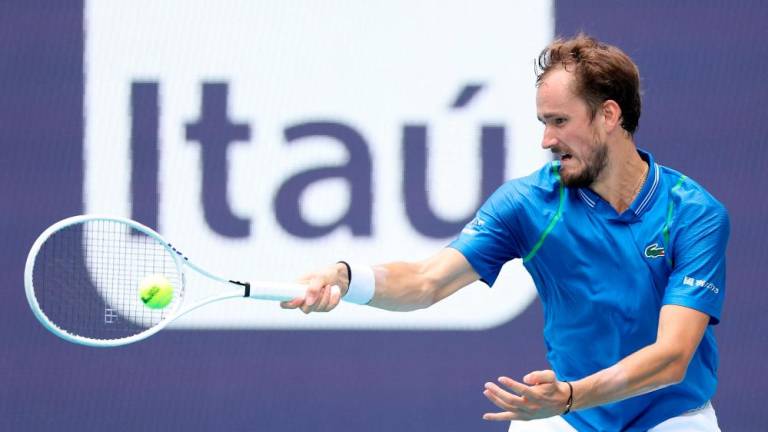 MIAMI GARDENS, FLORIDA - MARCH 30: Daniil Medvedev of Russia returns a shot to Christopher Eubanks of the United States during the quarterfinals of the Miami Open at Hard Rock Stadium on March 30, 2023 in Miami Gardens, Florida. AFPPIX