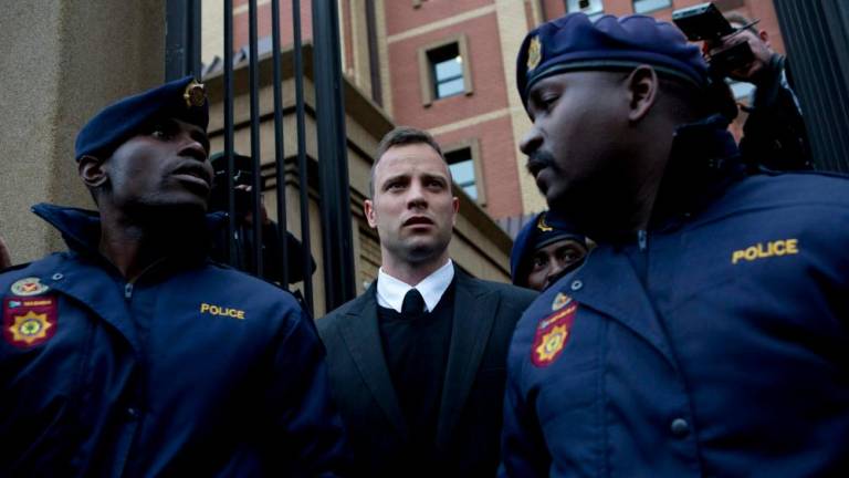 In this file photo taken on June 14, 2016 South African Paralympian Oscar Pistorius leaves the Pretoria High Court, on the second day of his pre sentencing hearing set to send him back to jail for murdering his girlfriend. AFPPIX