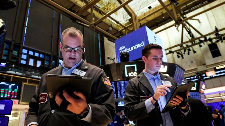 Traders working on the floor of the New York Stock Exchange on Thursday, March 23, 2023. – Reuterspic
