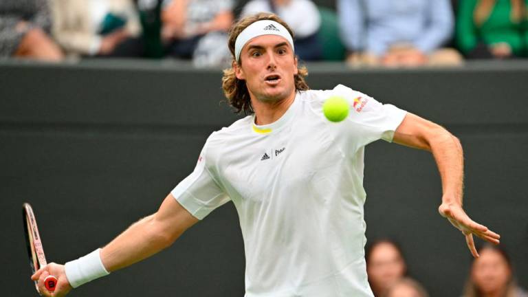 Greece’s Stefanos Tsitsipas returns the ball to Australia’s Jordan Thompson during their men’s singles tennis match on the fourth day of the 2022 Wimbledon Championships at The All England Tennis Club in Wimbledon, southwest London, on June 30, 2022. AFPPIX