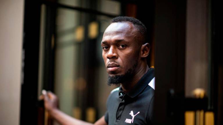 In this file photo taken on May 15, 2019, Jamaican Olympic sprinter Usain Bolt poses during a photo session as he launches a new brand of electric scooters named “Bolt” in Paris. AFPPIX