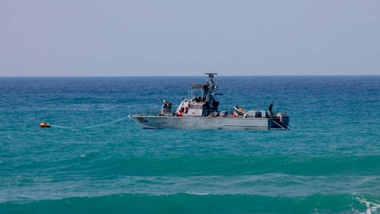 An Israeli navy vessel patrols Mediterranean waters off the coast of Rosh Hanikra, known in Lebanon as Ras al-Naqura, an area at the border between the two coutries, on October 4, 2022. AFPPIX