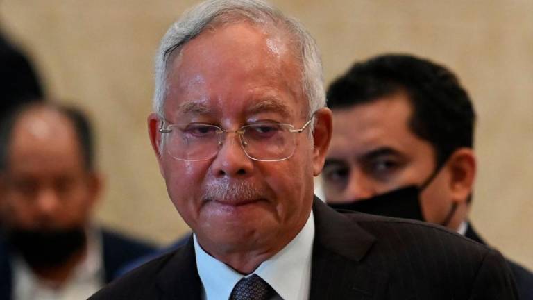 Malaysia's former prime minister Najib Razak reacts during a press conference at the federal court in Putrajaya on August 18, 2022. Malaysia's top court on August 18 began hearing ex-leader Najib Razak's appeal to overturn his jail sentence for corruption in a high-stakes legal gambit that can see him either locked up or launch a political comeback. AFPPIX