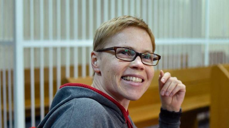In this file photo taken on March 04, 2019 Marina Zolotova, editor-in-chief of news portal tut.by, on trial over alleged “unauthorised access” to information from state-run BelTA news agency, smiles after hearing her sentence at a court in Minsk. AFPPIX