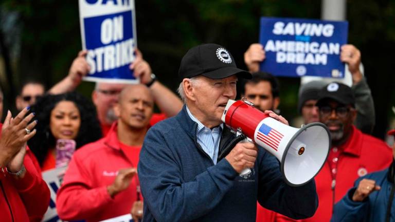 US President Joe Biden addresses striking members of the United Auto Workers (UAW) union at a picket line outside a General Motors Service Parts Operations plant in Belleville, Michigan, on September 26, 2023. AFPPIX