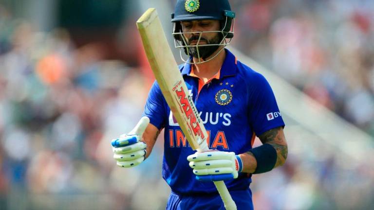 (FILES) In this file photo taken on July 17, 2022 India’s Virat Kohli walks back to the pavilion after losing his wicket during the final one-day international (ODI) cricket match between England and India at Old Trafford in Manchester. AFPPIX