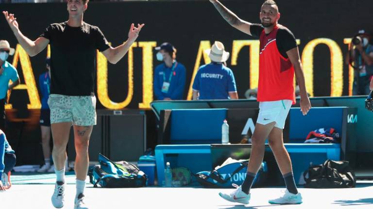 Australia’s Thanasi Kokkinakis (L) and Australia’s Nick Kyrgios react after winning against Spain’s Marcel Granollers and Argentina’s Horacio Zeballos during their men’s doubles semi-final match on day eleven of the Australian Open tennis tournament in Melbourne on January 27, 2022. AFPPIX