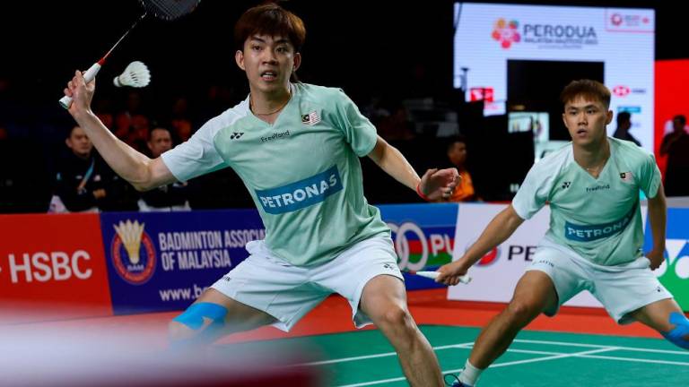 KUALA LUMPUR, 25 May -- National doubles action of Man Wei Chong (right) and Kai Wun Tee in the match against Scottish players Alexander Dunn and Adam Hall in the second round of the Perodua Malaysia Masters 2023 tournament at Axiata Arena Bukit Jalil today. BERNAMAPIX